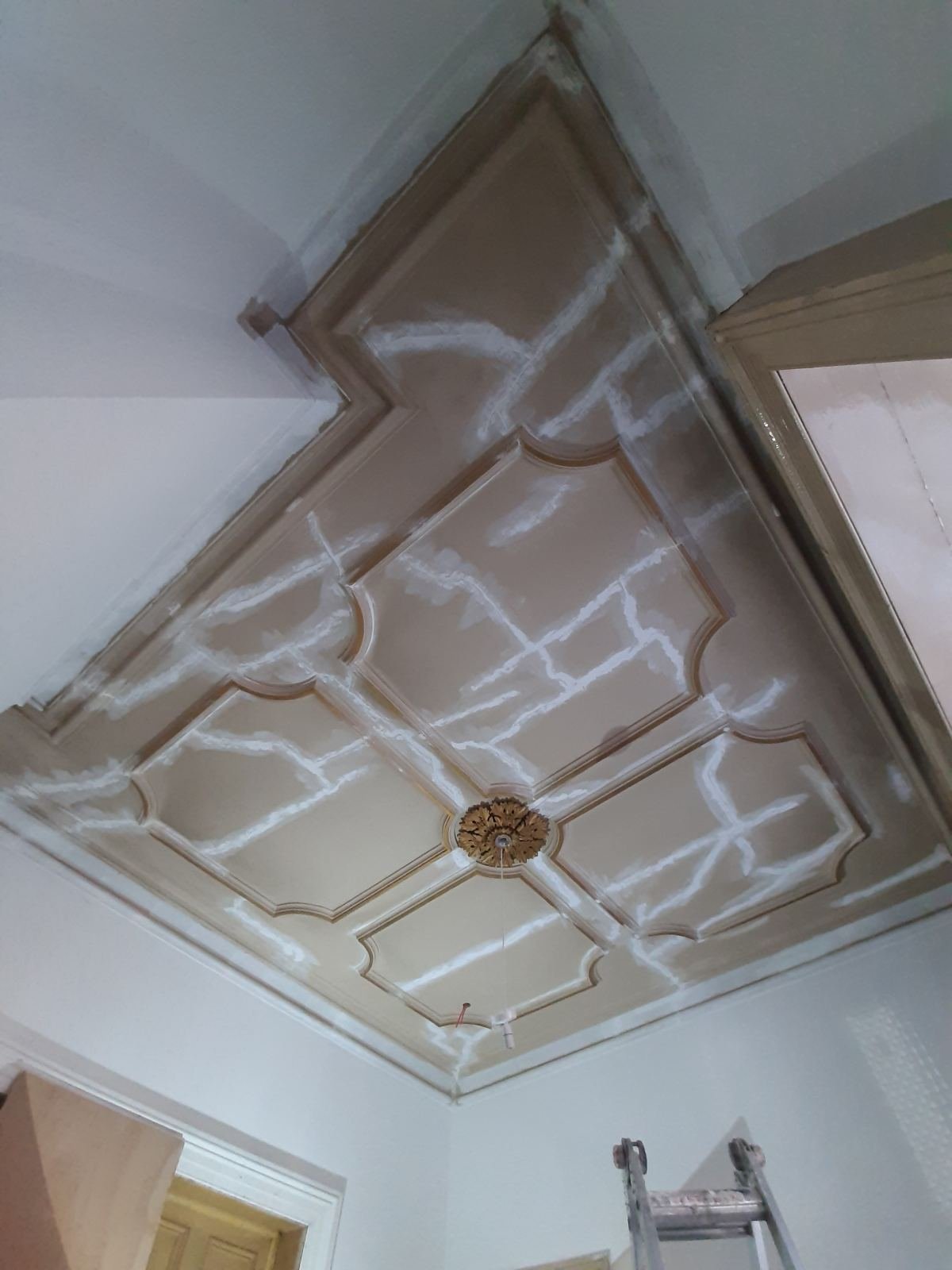 Ornate period ceiling in a Dublin home with cracks cut out and filled before repainting