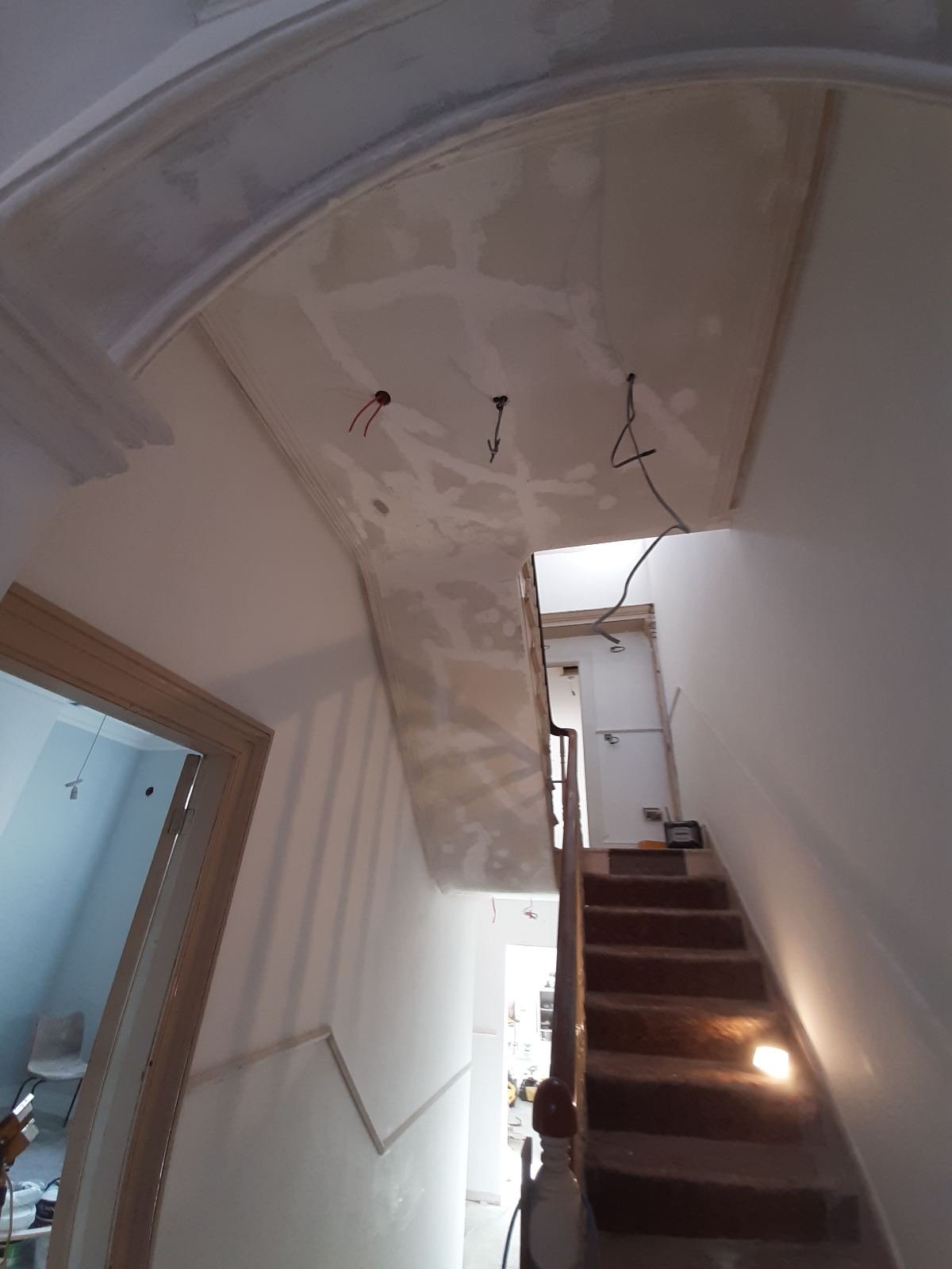 Stairwell walls and ceiling filled and made good in a Dublin period home, ready for sanding and paint